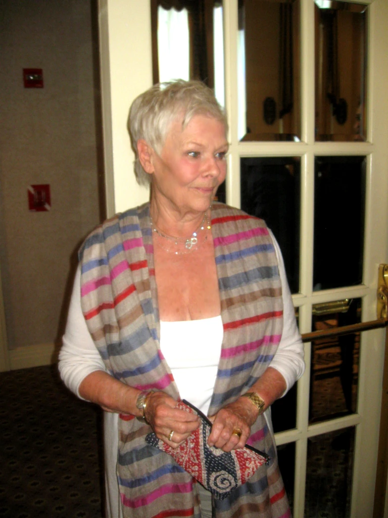 Dame Judi enters wearing her new Indian accessories!