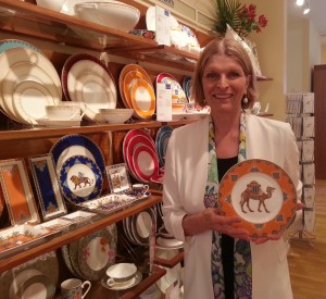 Isabelle Von Boch holding the popular Salad Plate Camel from the Samarkand Mandarin collection 